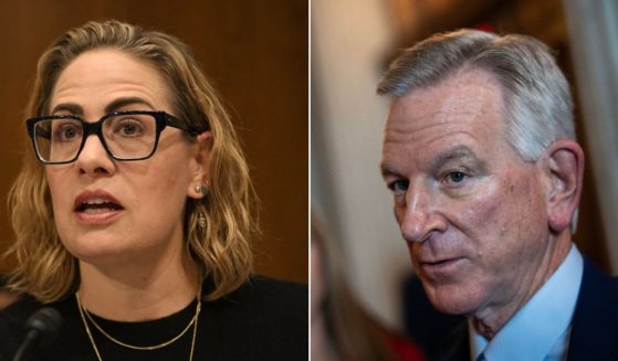 Senator Kyrsten Sinema of Arizona is attempting to shepherd a bipartisan solution to GOP Sen. Tommy Tuberville's hold on military promotions.