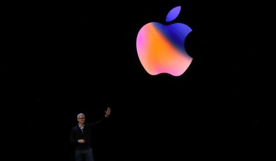 Apple CEO Tim Cook waves to the audience during an Apple special event at the Steve Jobs Theatre on the Apple Park campus on September 12, 2017 in Cupertino, California.