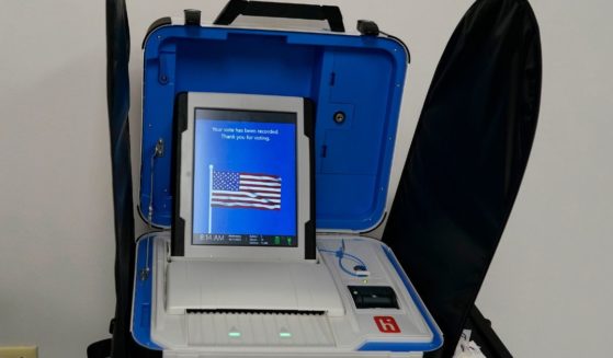 A voting machine displays, "Your vote has been recorded. Thank you for voting", after a voter successfully scanned a ballot during early in-person voting at the Hamilton County Board of Elections in Cincinnati on Oct. 11.