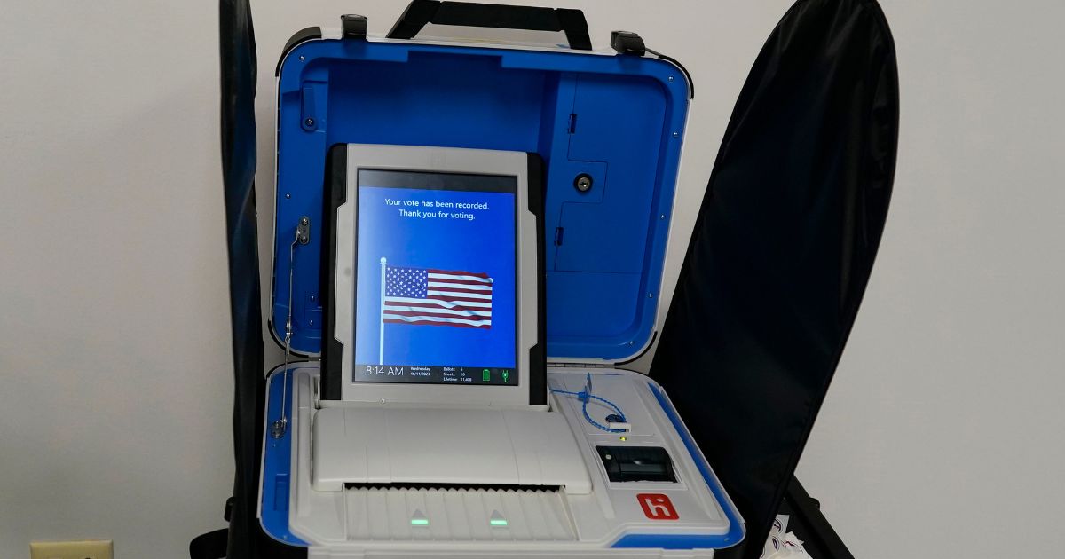 A voting machine displays, "Your vote has been recorded. Thank you for voting", after a voter successfully scanned a ballot during early in-person voting at the Hamilton County Board of Elections in Cincinnati on Oct. 11.
