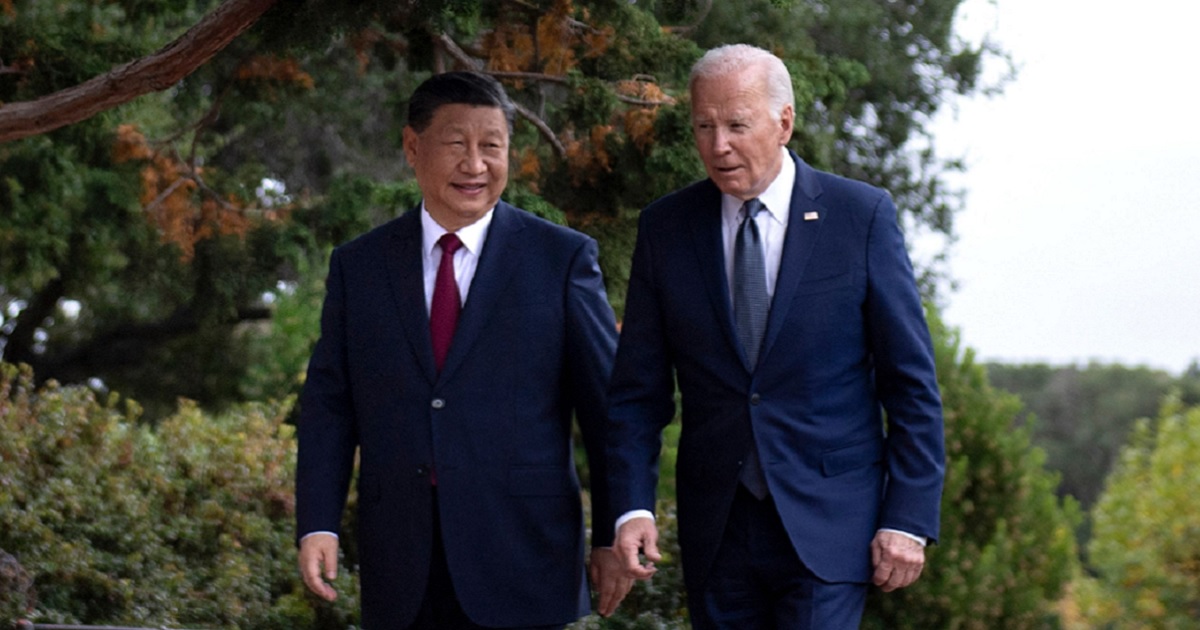 Chinese President Xi Jinping and President Joe Biden walk together Wednesday during the Asia-Pacific Economic Cooperating summit in San Francisco.