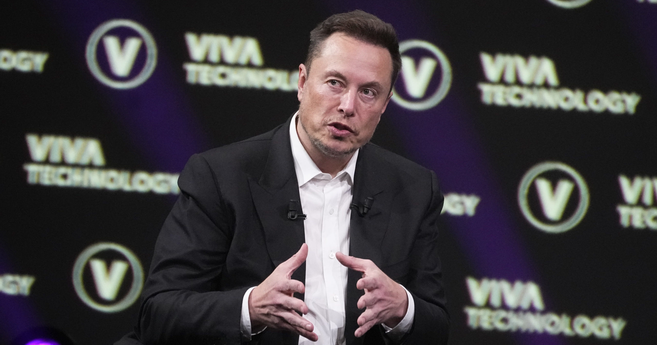 Elon Musk, who owns X, formerly known as Twitter, Tesla and SpaceX, speaks at the Vivatech fair, June 16, 2023, in Paris.