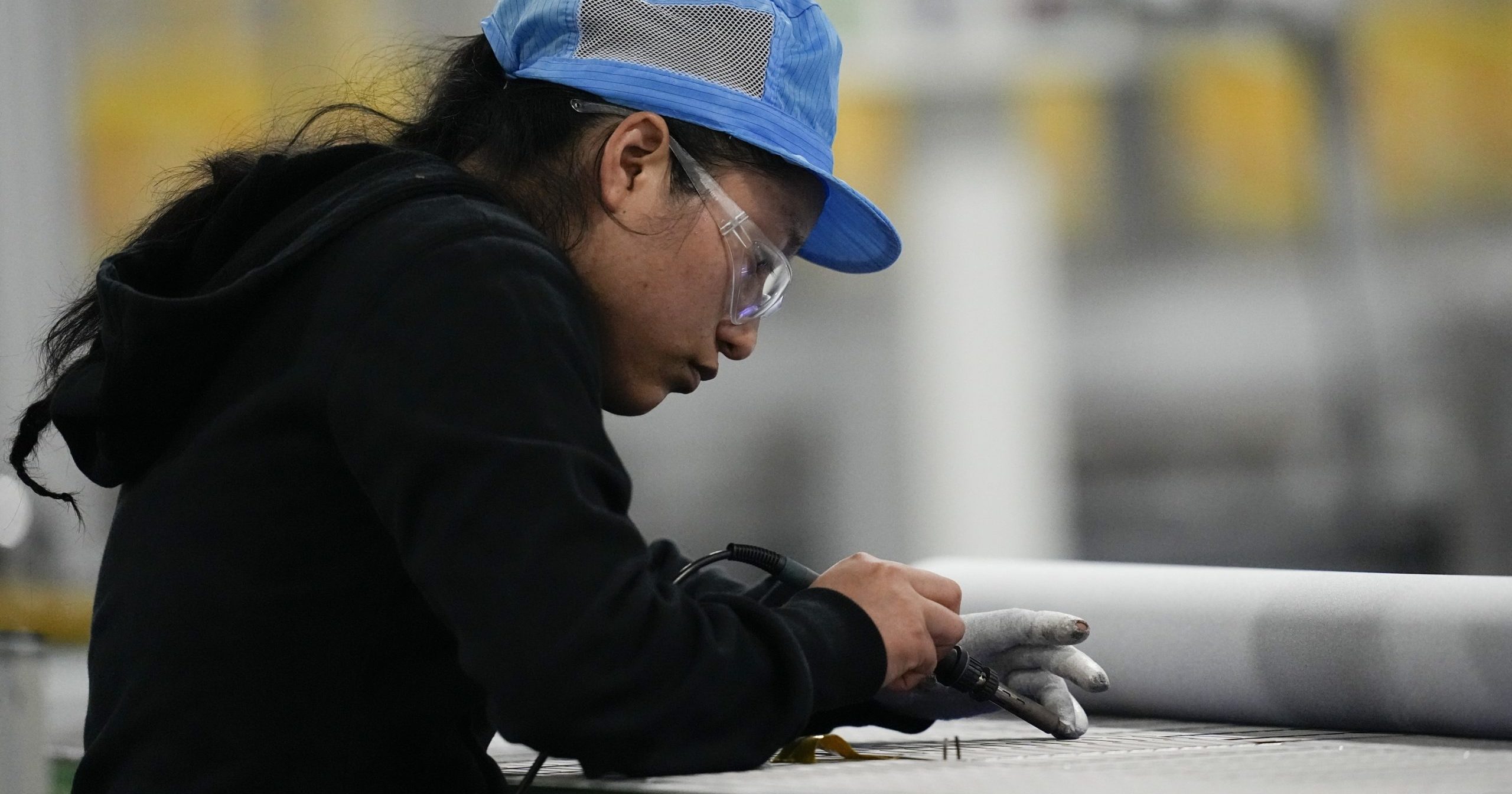 An employee works inside the Hanwha Qcells Solar plant in Dalton, Georgia, on Oct. 16.