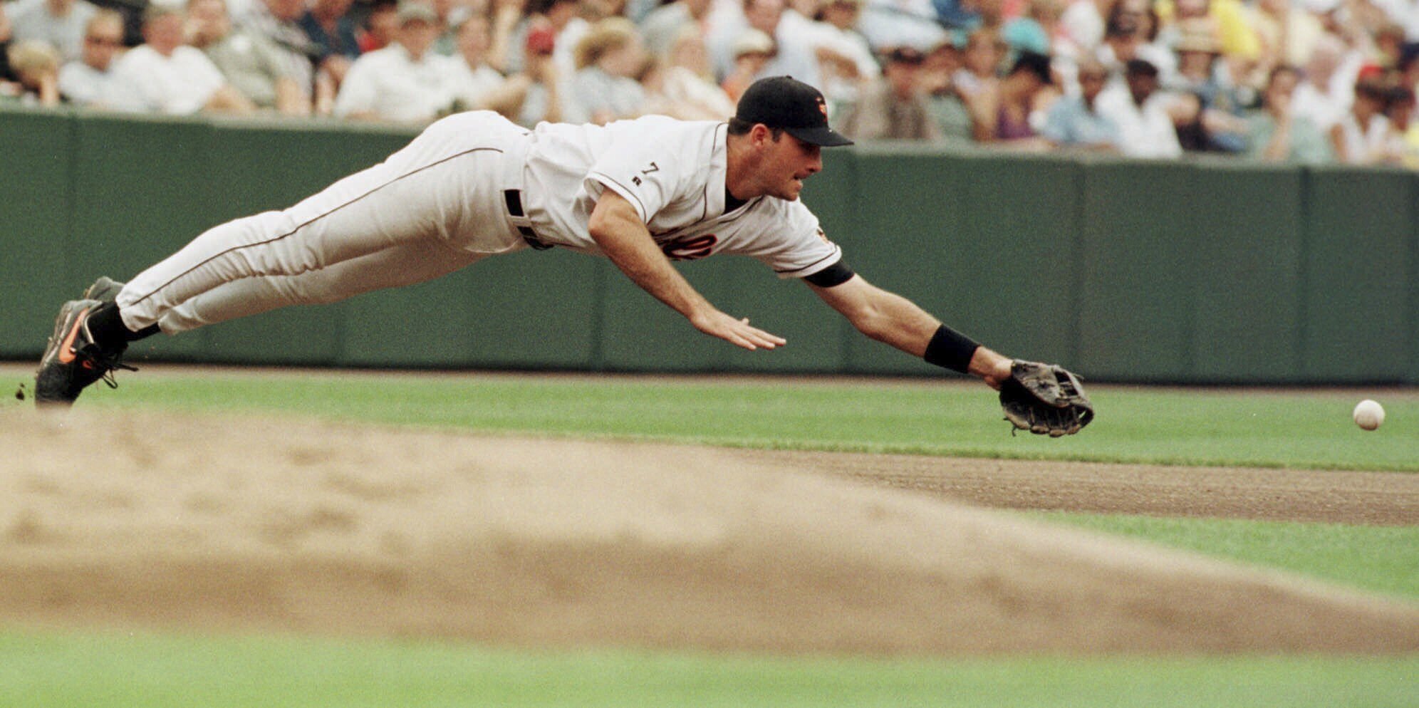 Baltimore Orioles third baseman Ryan Minor dives for a ball hit by the Detroit Tigers' Brad Ausmus during a game in Baltimore on Aug. 8, 1999. Minor died on Friday.