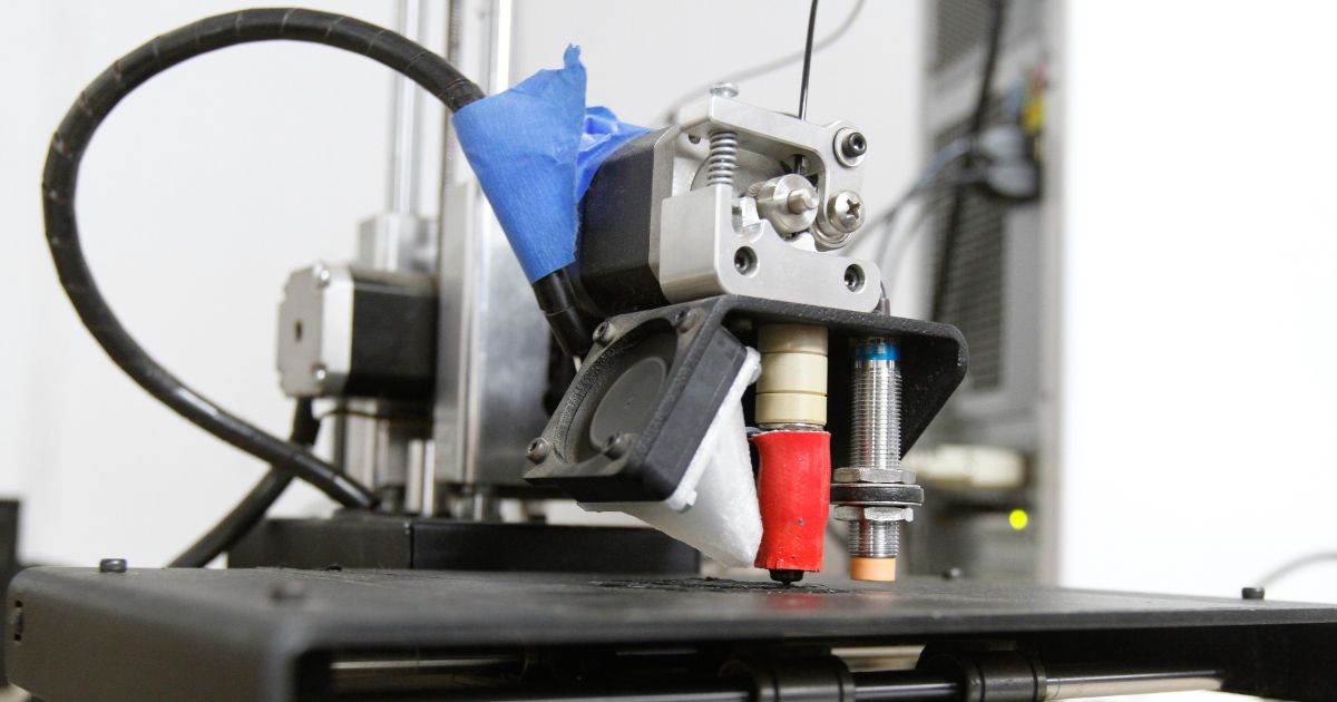 An undated stock photo shows a 3-D printer at work.