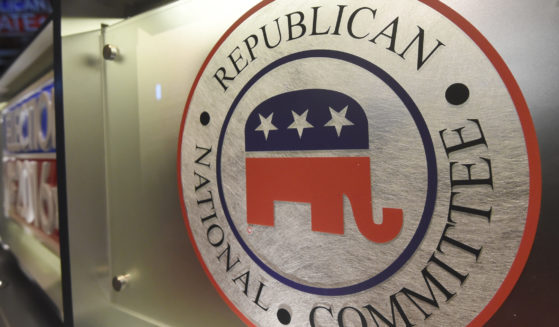 The Republican National Committee logo is shown on the stage as crew members work at the North Charleston Coliseum in North Charleston, South Carolina, on Jan. 13, 2016.