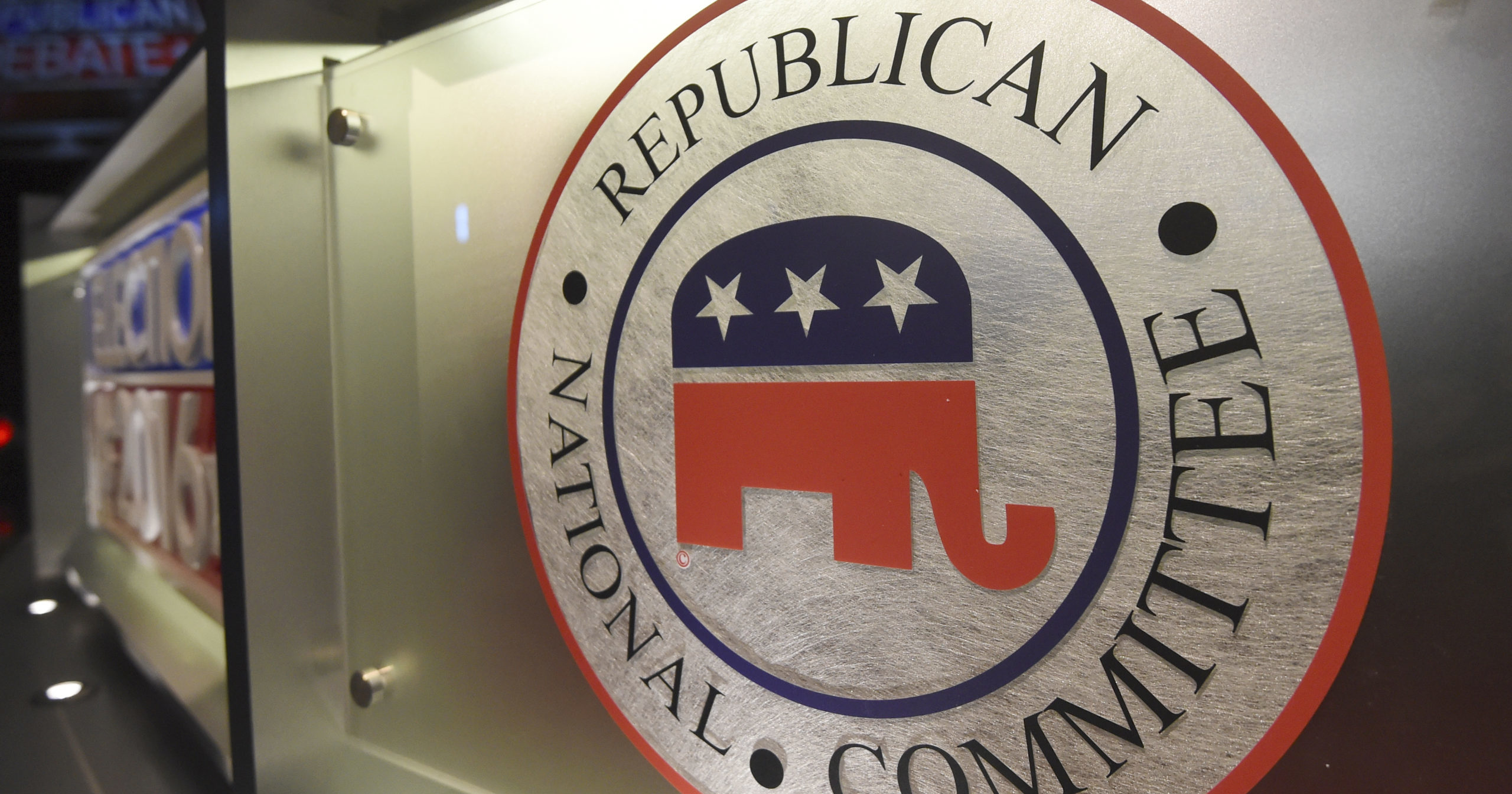 The Republican National Committee logo is shown on the stage as crew members work at the North Charleston Coliseum in North Charleston, South Carolina, on Jan. 13, 2016.