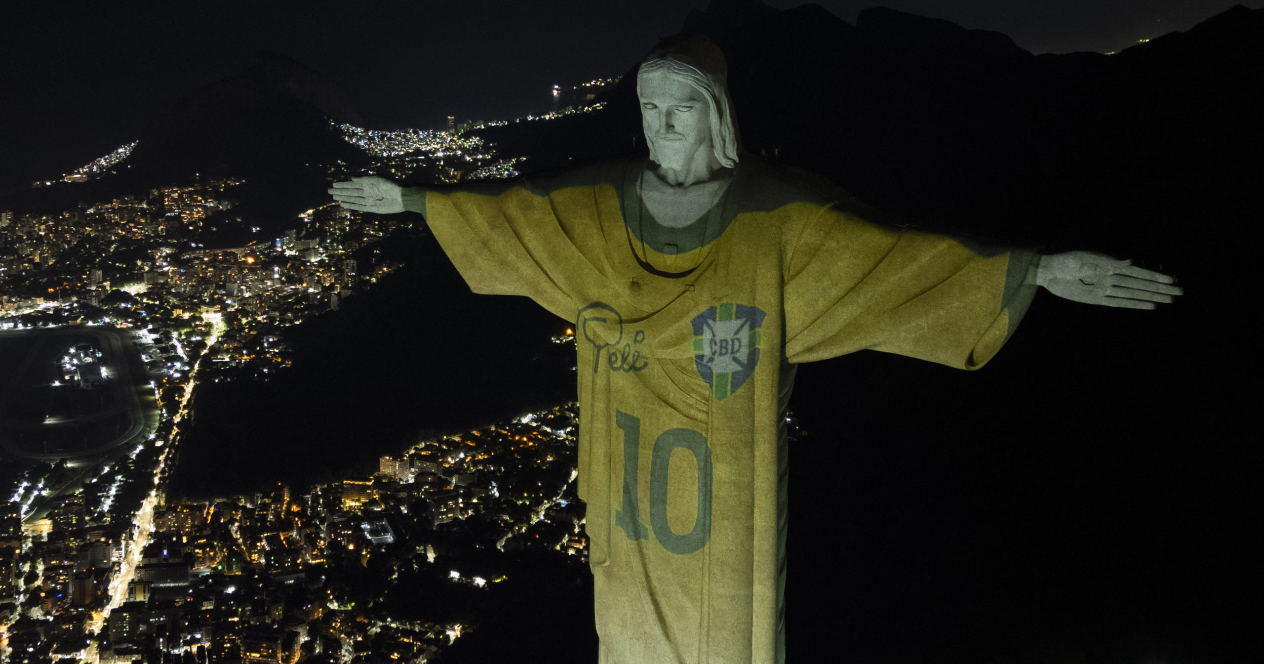 The Christ the Redeemer statue is illuminated with an image of Pele's Brazilian jersey in Rio de Janeiro, Brazil, on Friday.
