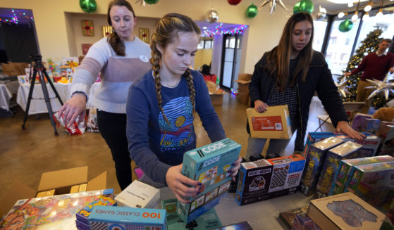 Volunteers arrange toys at The Toy Store, a free, referral-based toy store, in Nashville, Tennessee, on Thursday.