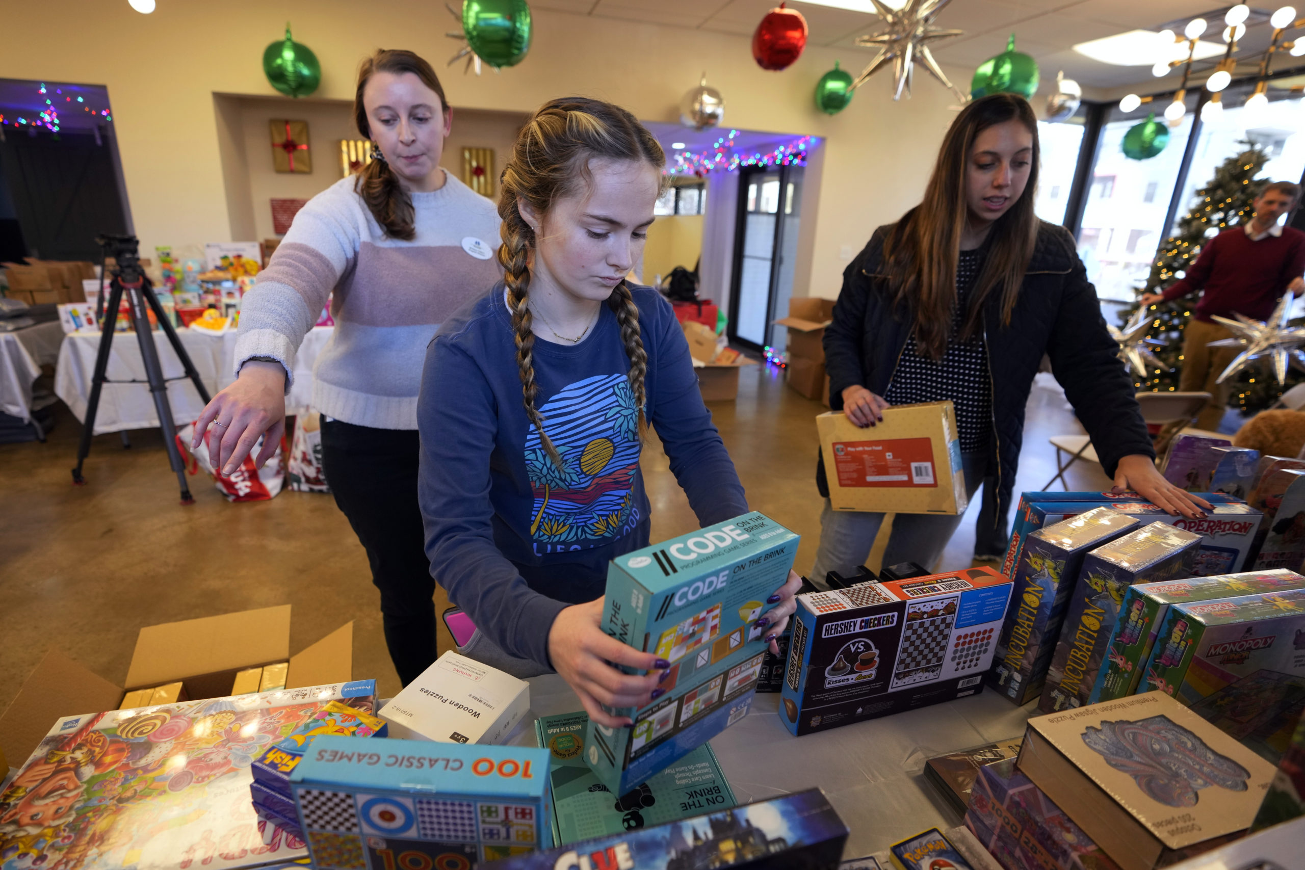 Volunteers arrange toys at The Toy Store, a free, referral-based toy store, in Nashville, Tennessee, on Thursday.