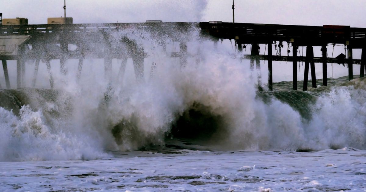 A large and turbulent wave breaks near the Ventura pier on Saturday in Ventura, Calif.