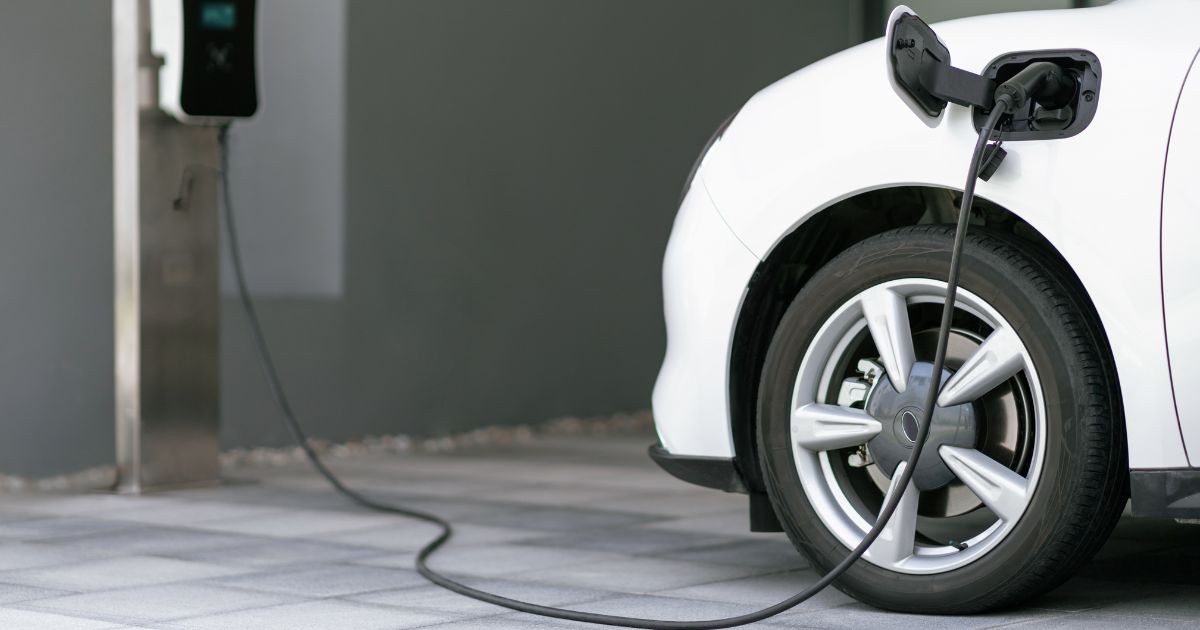 An undated stock photo shows an electric vehicle charging.