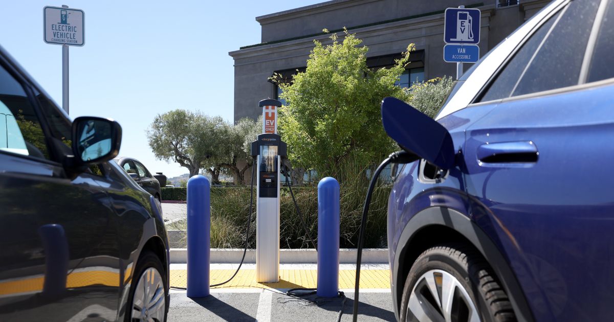Electric cars sit parked at a Charge Point EV charging station in Corte Madera, California, on July 28.