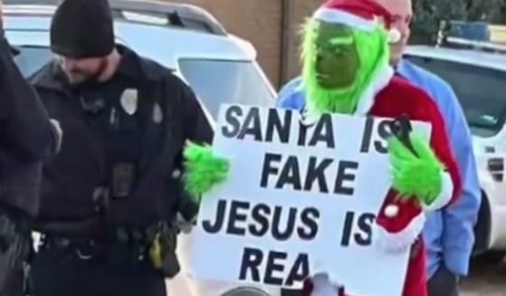 Street preacher David Harold Grisham dressed as the Grinch and stood outside Sleepy Hollow Elementary School in Amarillo, Texas, in late November, holding a sign that read, "Santa is fake Jesus is real" and sparking outrage in parents and administrators.