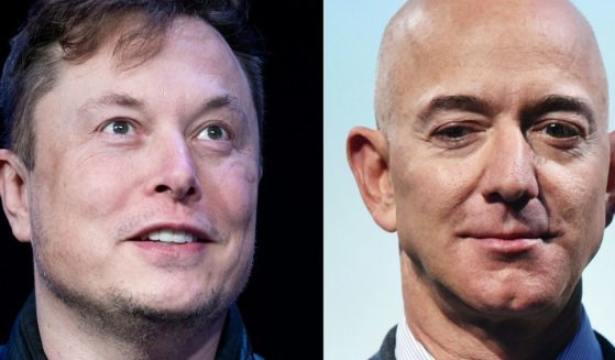 Business and tech rivals Elon Musk, left, and Jeff Bezos.