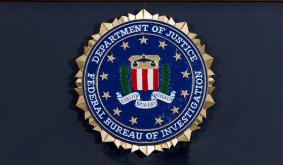 The FBI seal is displayed on a podium before a news conference at the agency's headquarters on June 14, 2018, in Washington, D.C.