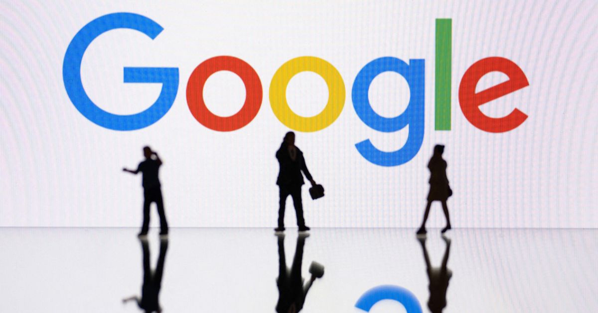 Figurines are seen in front of a screen displaying the Google logo on Oct. 30 in Mulhouse, eastern France.