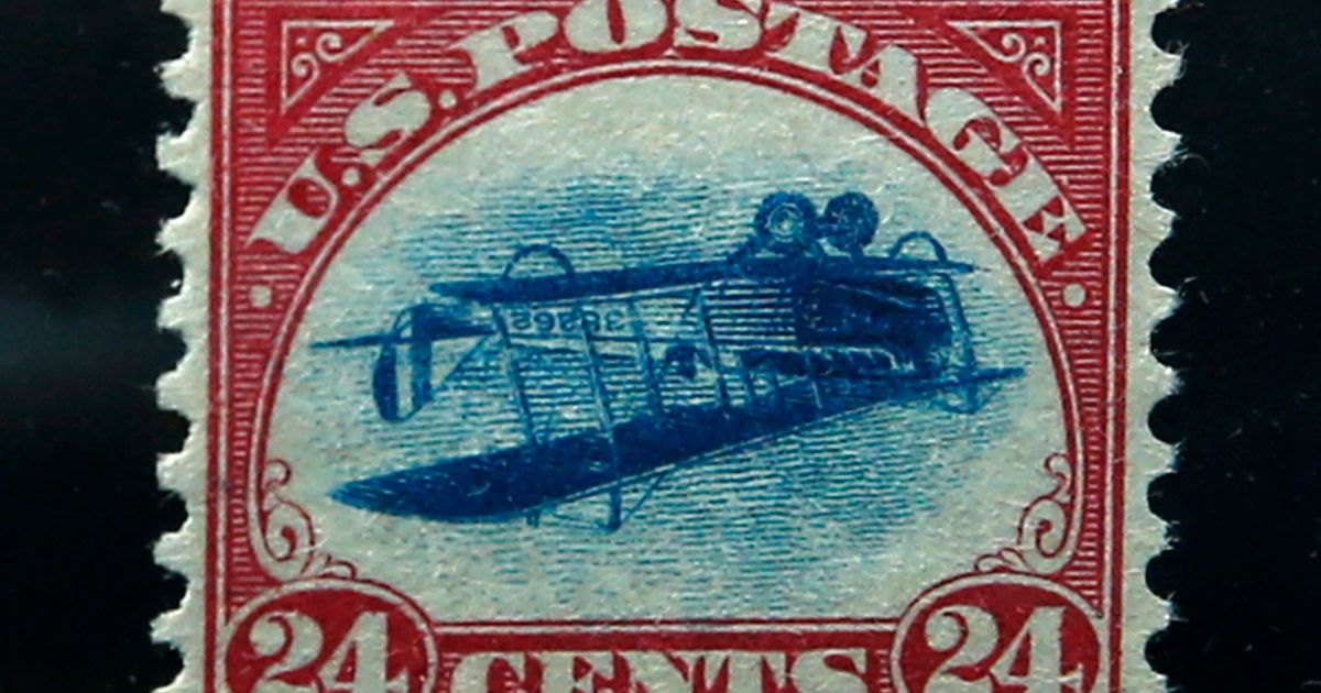 This photograph shows an "Inverted Jenny" stamp, which depicts a plane upside down due to a printing error. These stamps can be worth a fortune.
