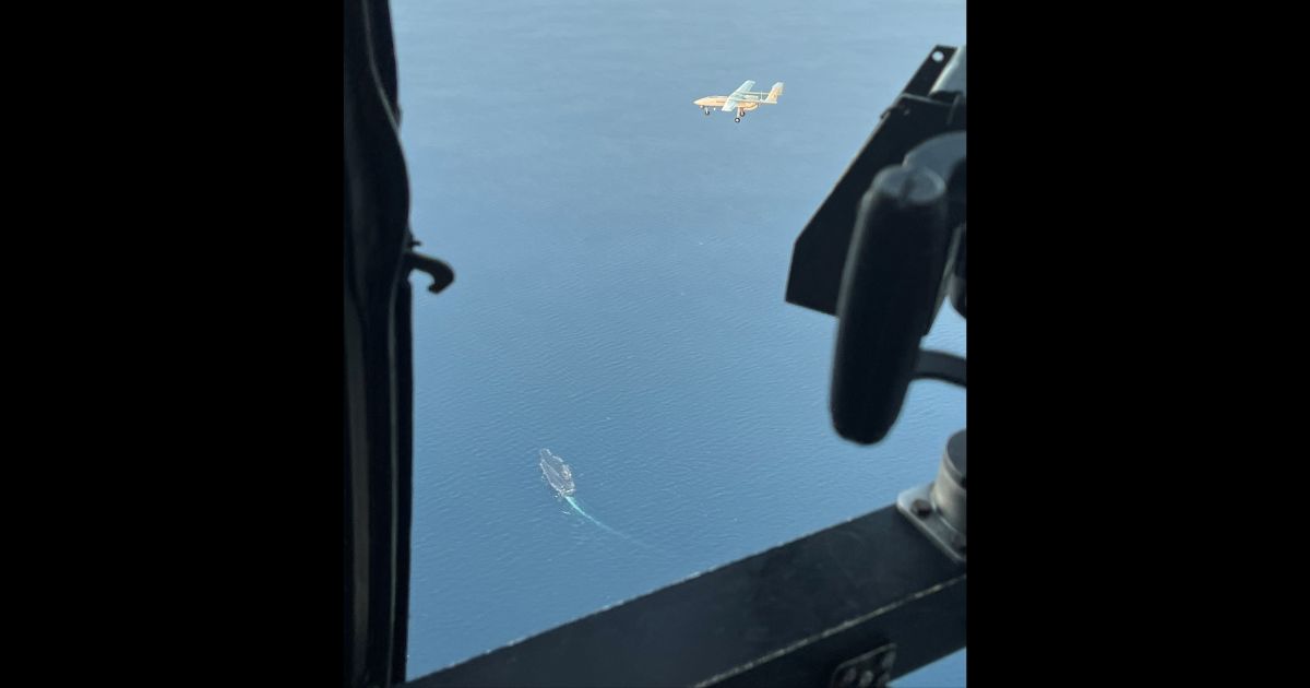 An Iranian drone is seen from a U.S. Navy helicopter.