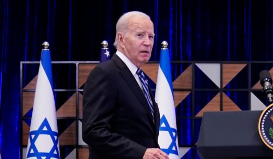 U.S. President Joe Biden stepping up to a podium to make a speech
