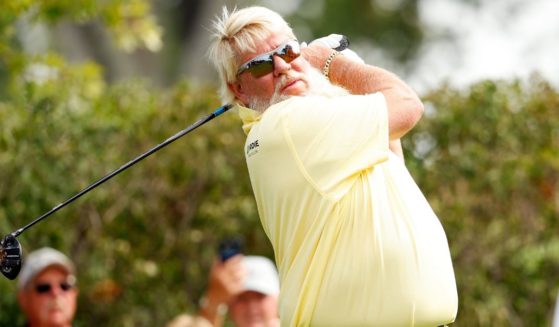 John Daly of the United States plays his tee shot on the third hole during the first round of the Sanford International in Sioux Falls, South Dakota, on Sept. 15. In a recent interview with Tucker Carlson, Daly admitted he has a major habit - drinking Diet Coke.