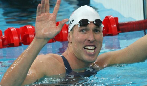 Klete Keller smiles after winning a men's 4 x 200-meter freestyle relay heat at the 2008 Beijing Olympic Games on Aug. 12, 2008.