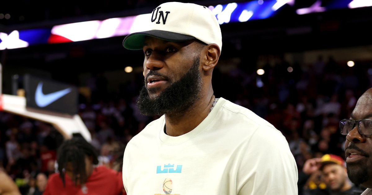 NBA star LeBron James finds his seat prior to the game between the USC Trojans and the Long Beach State 49ers in Los Angeles, California, on Sunday.