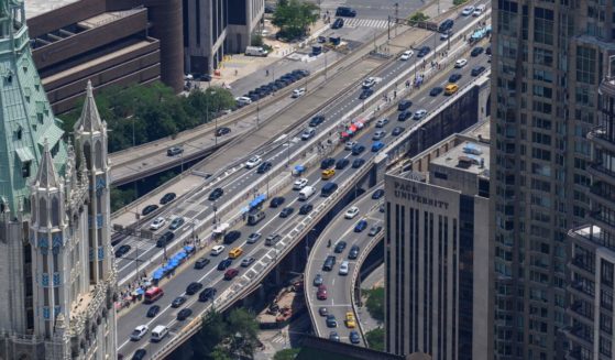 Vehicles move along a street in the Manhattan borough of New York City on July 24.