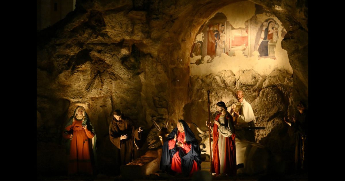The crib of the baby Jesus is unveiled in the Nativity scene at St. Peter's Square in The Vatican on Saturday.