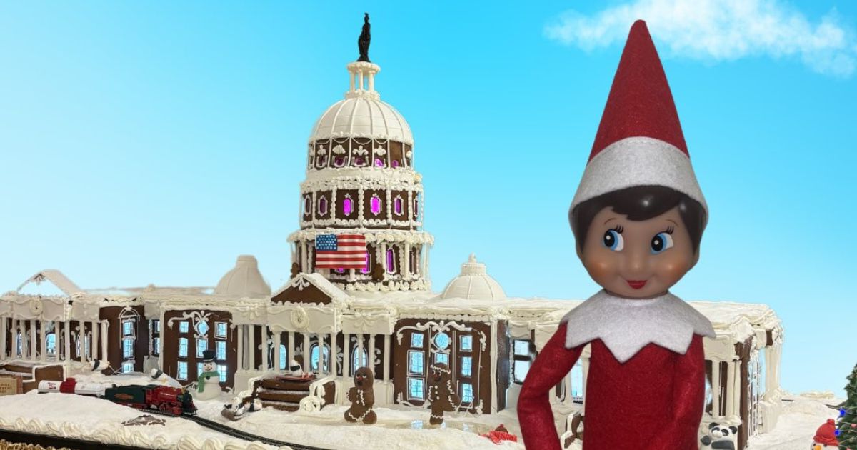 Nutmeg the elf is seen with a gingerbread version of the U.S. Capitol.