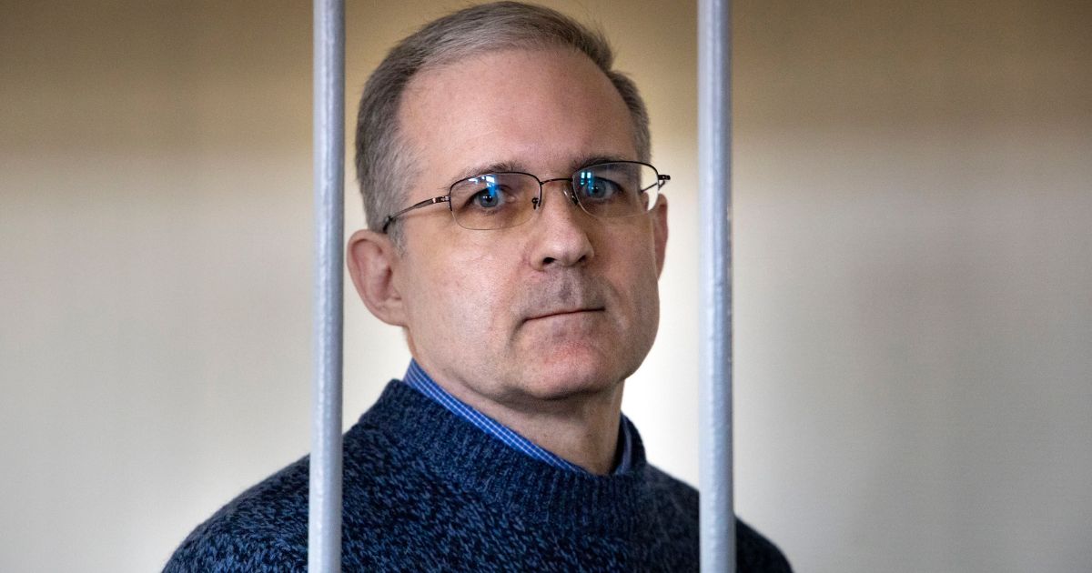 Former Marine Paul Whelan, who was arrested for espionage in Russia in 2018, speaks while standing in a cage as he waits for a hearing in a courtroom in Moscow, Russia. on Aug. 23, 2019.