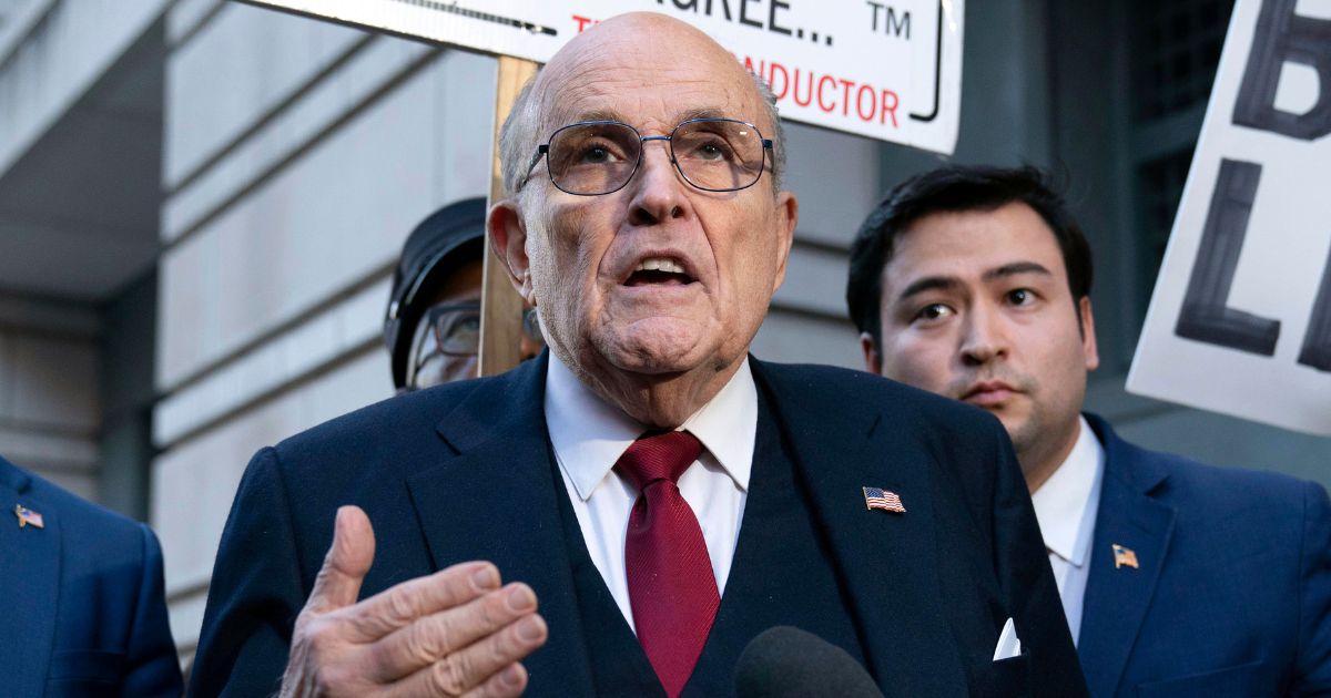 Former New York Mayor Rudy Giuliani speaks outside the federal courthouse in Washington on Friday.