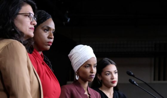 "Squad" members Reps. Rashida Tlaib, left, Ayanna Pressley, left middle, Ilhan Omar, right middle, and Alexandria Ocasio-Cortez, right, pause between answering questions during a press conference at the U.S. Capitol in Washington, D.C., on July 15, 2019.