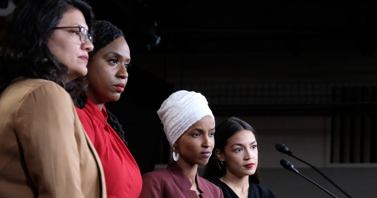 "Squad" members Reps. Rashida Tlaib, left, Ayanna Pressley, left middle, Ilhan Omar, right middle, and Alexandria Ocasio-Cortez, right, pause between answering questions during a press conference at the U.S. Capitol in Washington, D.C., on July 15, 2019.