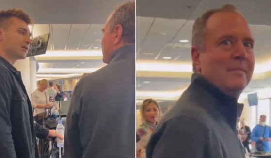 Rep. Adam Schiff, right, is confronted by pro-Trump activist/strategist Alex Bruesewitz, left, at an airport.