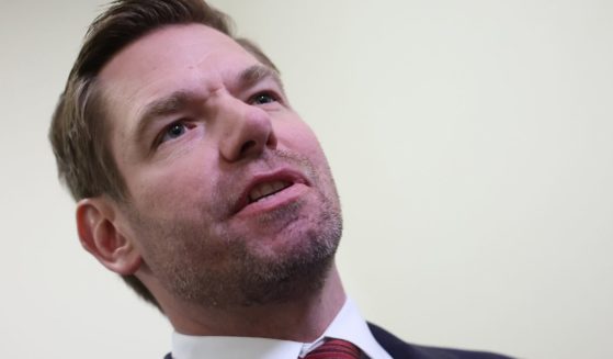 Democratic Rep. Eric Swalwell of California speaks to reporters at the Rayburn House Office Building in Washington on Wednesday. President Joe Biden's son, Hunter Biden, defied a subpoena from Congress to testify behind closed doors ahead of a House vote on an impeachment inquiry against his father.