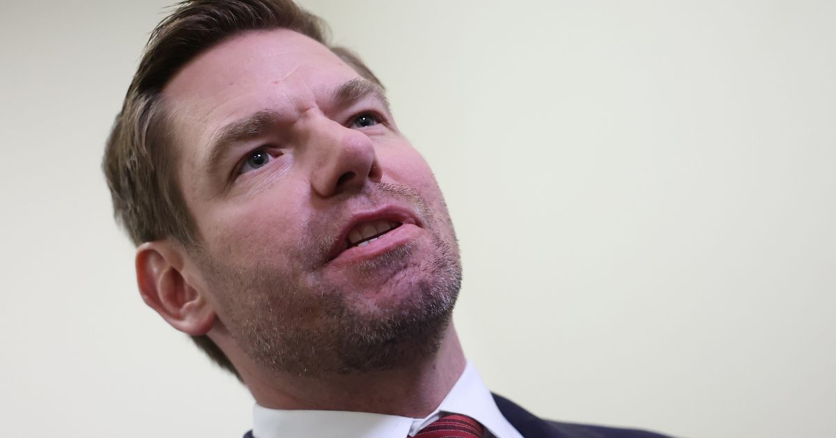 Democratic Rep. Eric Swalwell of California speaks to reporters at the Rayburn House Office Building in Washington on Wednesday. President Joe Biden's son, Hunter Biden, defied a subpoena from Congress to testify behind closed doors ahead of a House vote on an impeachment inquiry against his father.