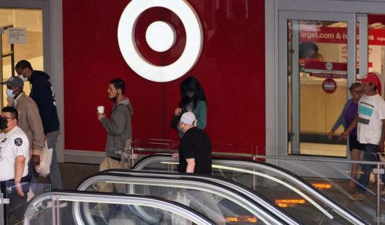 Shoppers walk into and out of a Target in downtown Los Angeles, California, on March 15, 2022.
