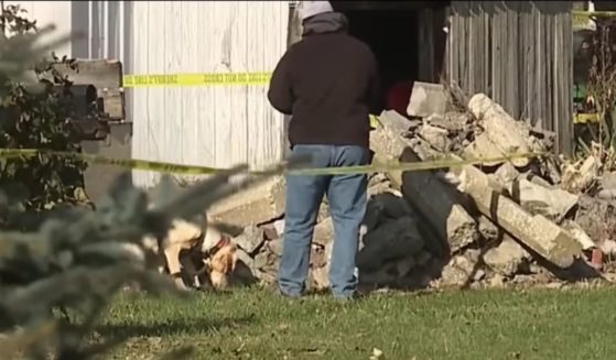 The teen's body was found under some rubble in the neighbor's yard.