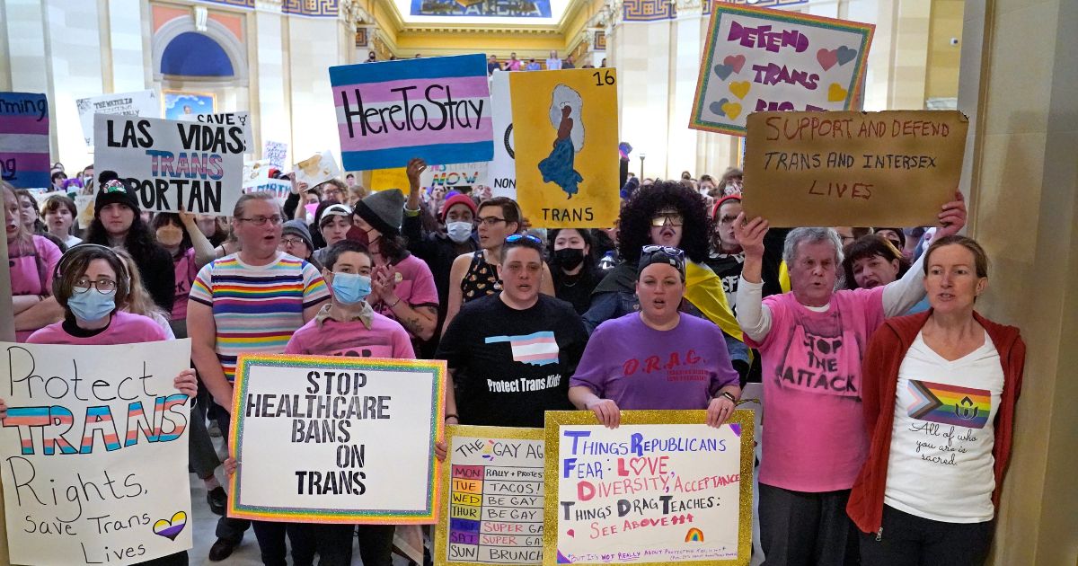 Protesters for transgender rights demonstrate outside the House chamber at the Oklahoma Capitol in Oklahoma City before the State of the State address on Feb. 6.