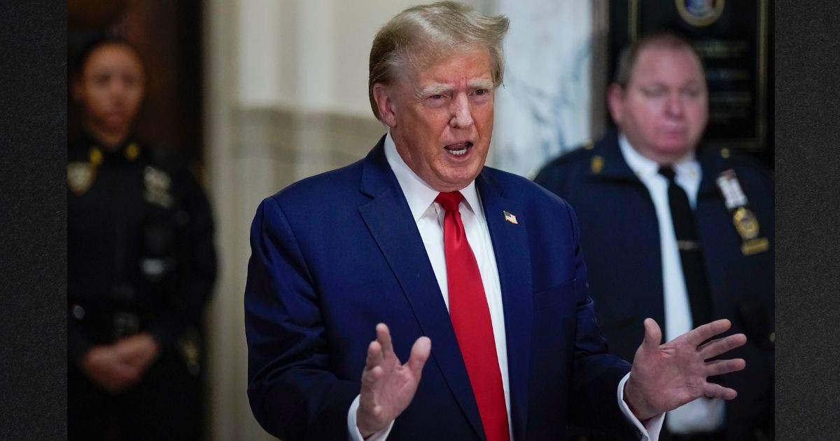 Former U.S. President Donald Trump paused to make a statement after arriving for his civil business fraud trial in New York State Supreme Court Thursday in New York City.