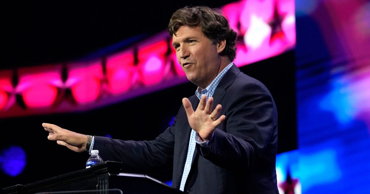 Tucker Carlson speaks at the Turning Point Action conference in West Palm Beach, Florida, on July 15. On Monday, Carlson launched his new streaming service.