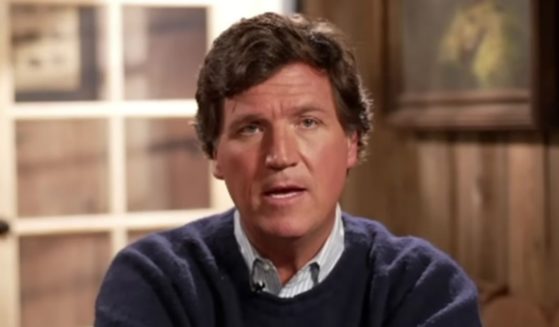Tucker Carlson answering a question during an interview