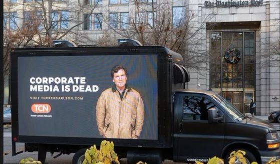 Tucker Carlson trolled mainstream media outlets with billboard trucks parked throughout New York City bearing the message, "Corporate Media Is Dead."