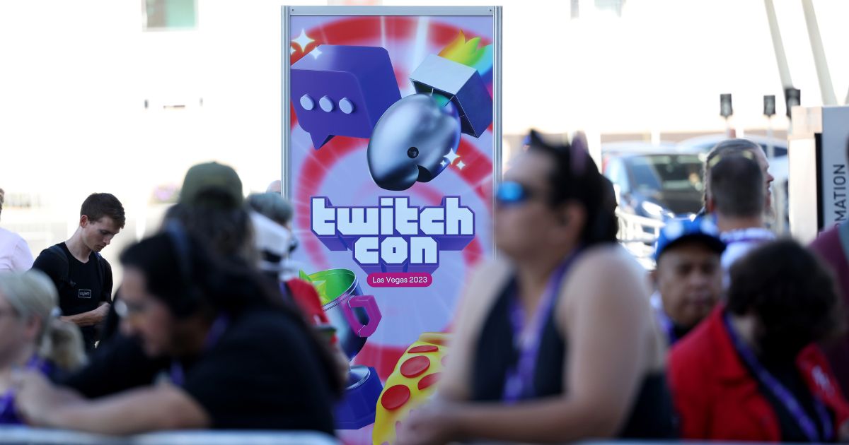 A TwitchCon sign is displayed near attendees awaiting to get into TwitchCon 2023 Las Vegas at the Las Vegas Convention Center on Oct. 20, 2023, in Las Vegas, Nevada.
