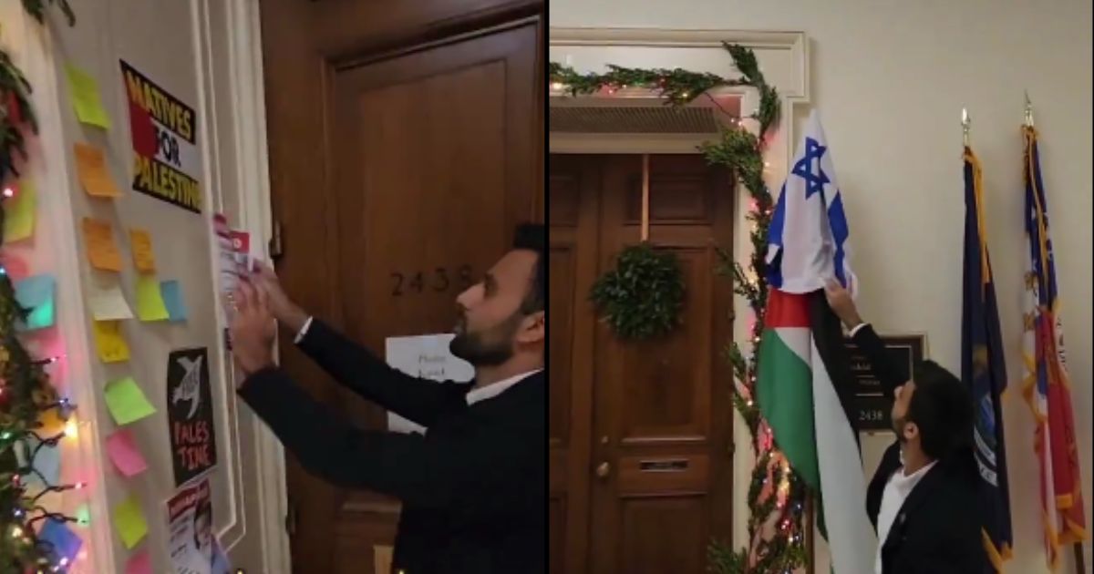 Israeli activist Yoseph Haddad redecorates outside the office of Michigan Rep. Rashida Tlaib.
