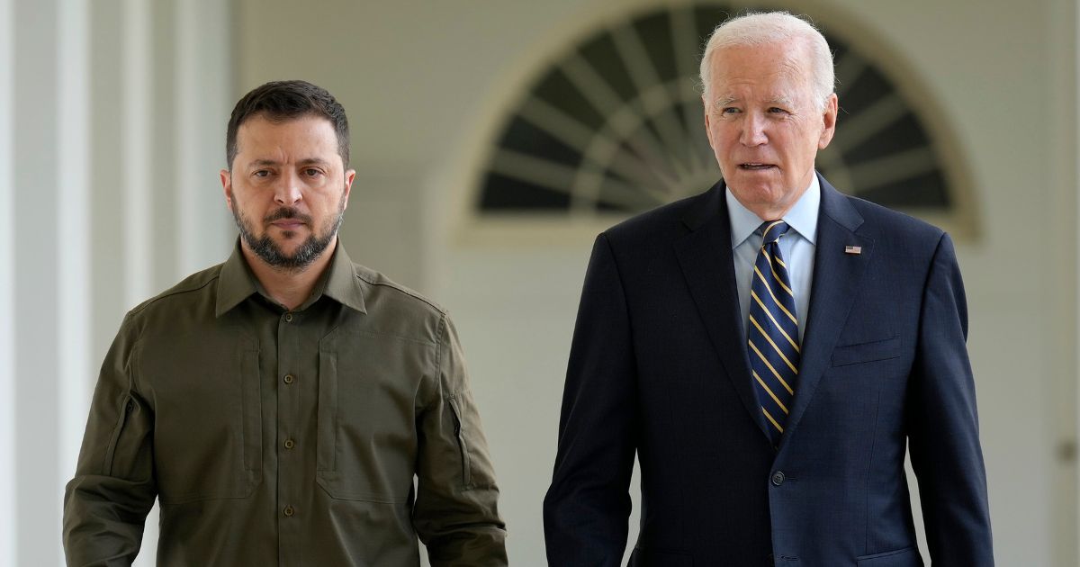 Ukrainian President Volodymyr Zelenskyy, left, walks with President Joe Biden, right, down the colonnade to the Oval Office during a visit to the White House in Washington, D.C., on Sept. 21.