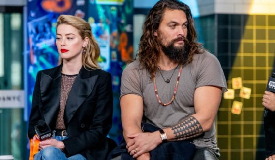 Actress Amber Heard and actor Jason Momoa discuss the 2018 "Aquaman" film in a December 2018 file photo at the Build Studio in New York City.