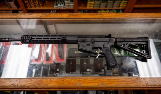 In this photo illustration, a semi-automatic AR-15 is displayed on a countertop at the McBride Guns Inc. store on August 25, 2023 in Austin, Texas.