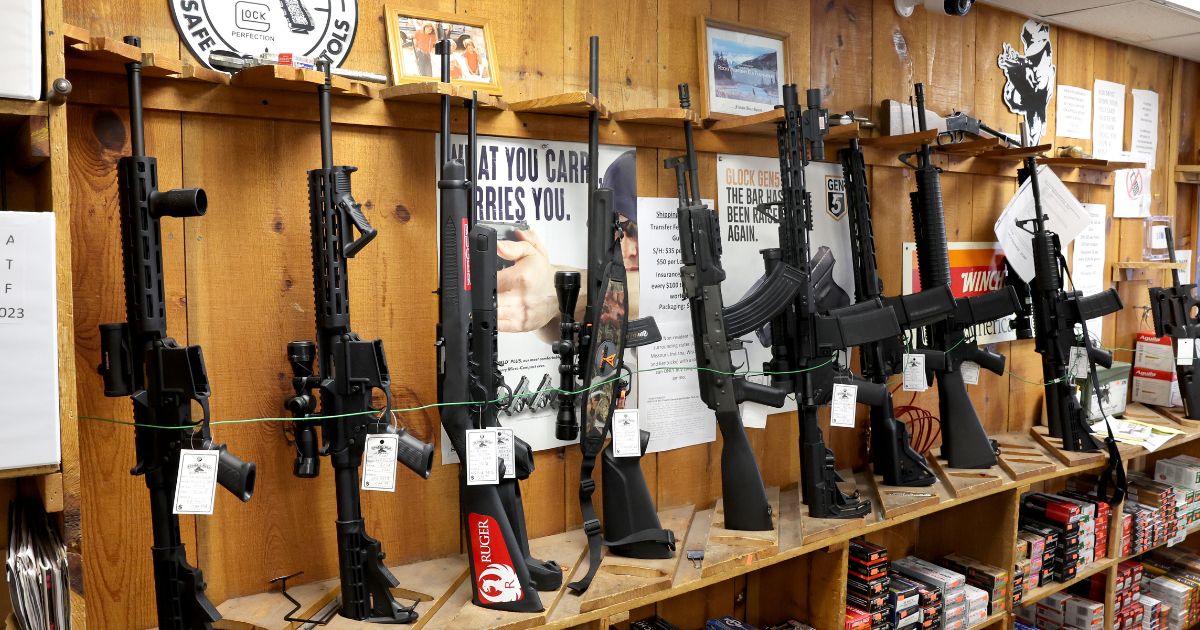 "Assault-style" rifles are displayed at Freddie Bear Sports on Jan. 11, 2023, in Tinley Park, Illinois. Workers began removing banned items from display that morning after Illinois Gov. J.B. Pritzker signed legislation the night before, banning the sale of guns classified as assault weapons, rifle magazines capable of holding more than 10 rounds and pistol magazines capable of holding more than 15 rounds in the state. The law is due to go into effect Jan. 1 after the Supreme Court declined to block the ban while it is appealed.